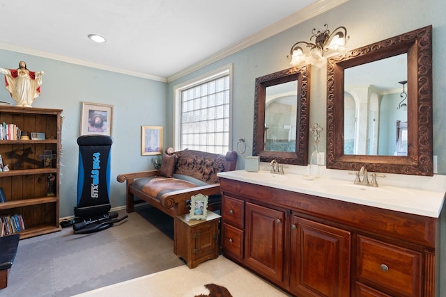 bathroom with ornamental molding and vanity