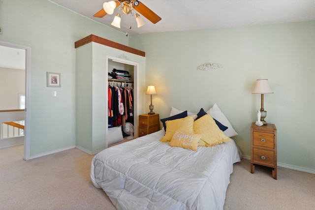 carpeted bedroom featuring vaulted ceiling, ceiling fan, and a closet