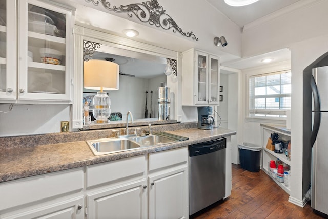 kitchen featuring white cabinetry, stainless steel appliances, sink, ornamental molding, and dark hardwood / wood-style floors