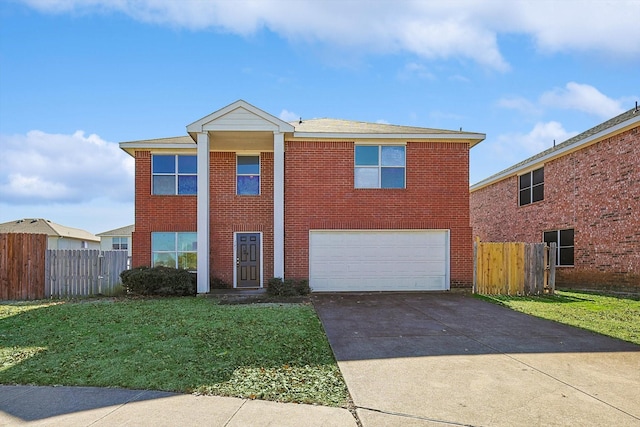 view of front property featuring a garage and a front yard