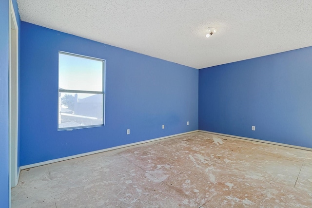 spare room featuring a textured ceiling