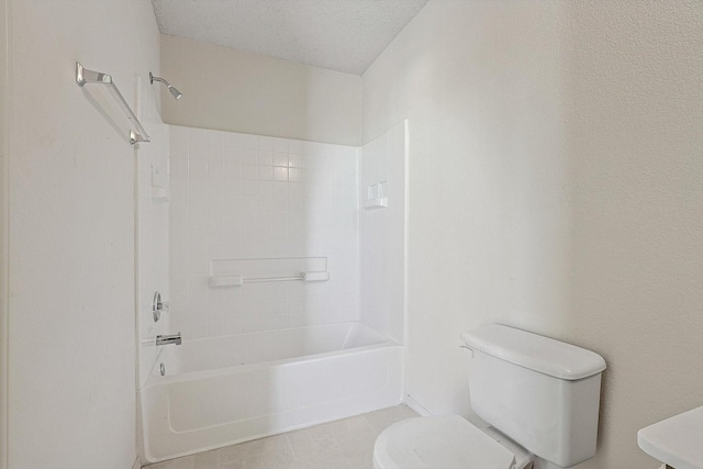 bathroom with tile patterned flooring, a textured ceiling, toilet, and shower / bath combination