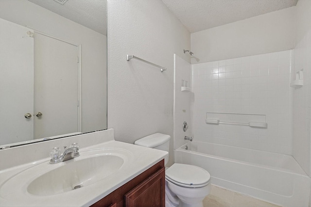 full bathroom with shower / bath combination, vanity, a textured ceiling, and toilet