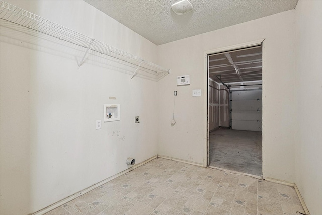 laundry area featuring washer hookup, a textured ceiling, and electric dryer hookup