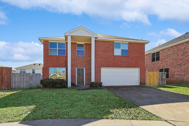 view of front of house with a garage and a front lawn