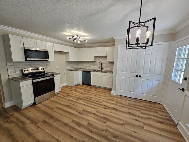 kitchen featuring white cabinetry and appliances with stainless steel finishes