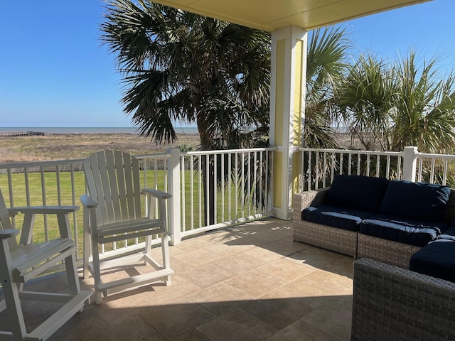 balcony with outdoor lounge area and a patio area