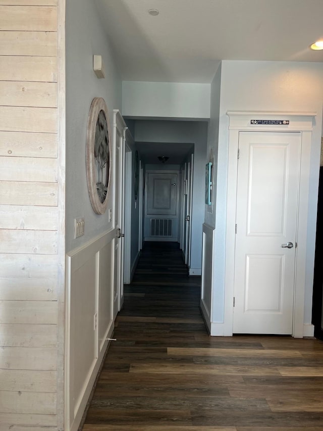 corridor with dark wood-type flooring