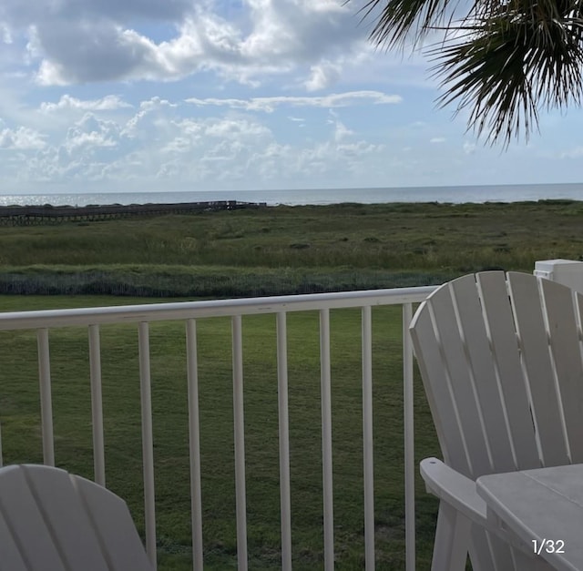 exterior space with a water view and a yard