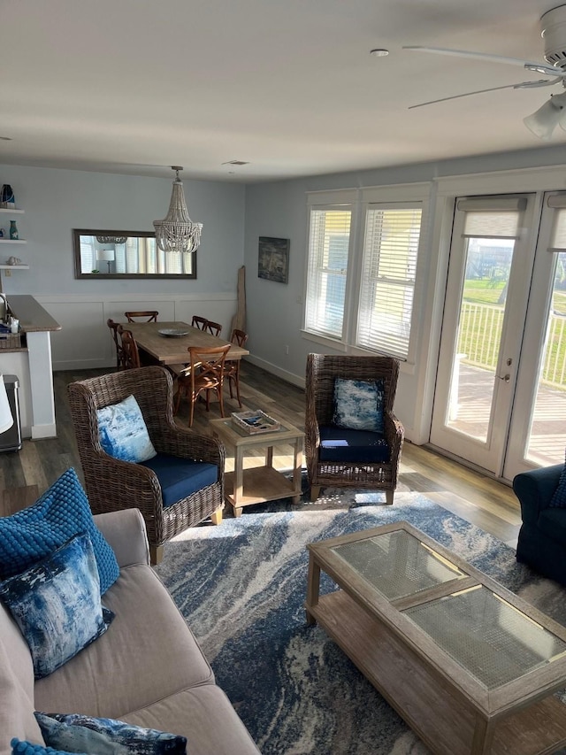 living room featuring hardwood / wood-style floors, plenty of natural light, and ceiling fan