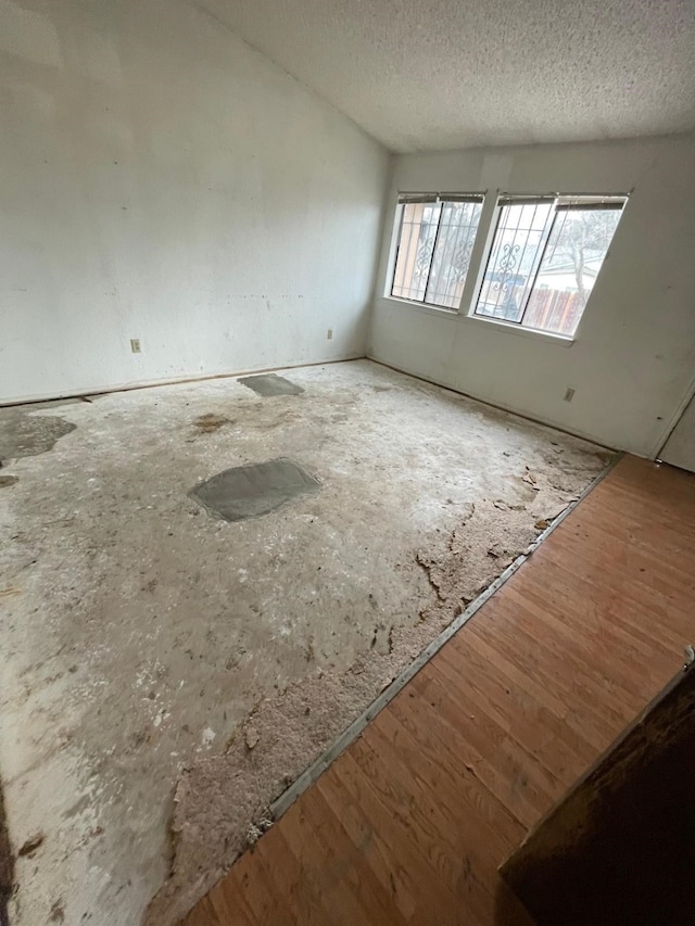 empty room with a textured ceiling