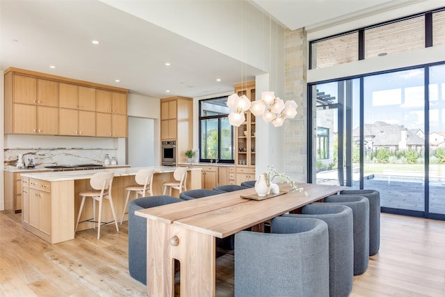 dining area featuring light wood-type flooring