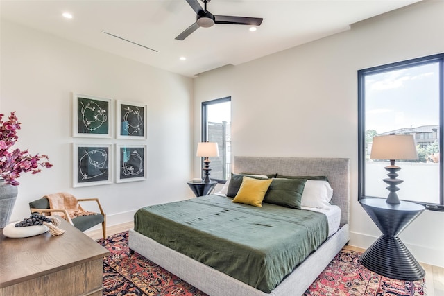 bedroom featuring hardwood / wood-style flooring and ceiling fan