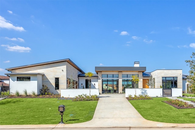 contemporary house with a front yard