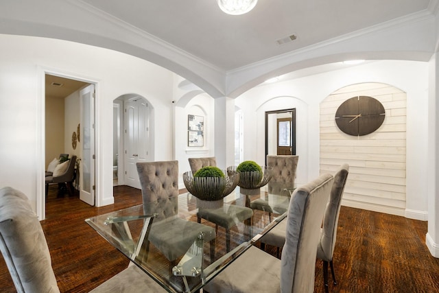 dining space with dark wood-type flooring and crown molding