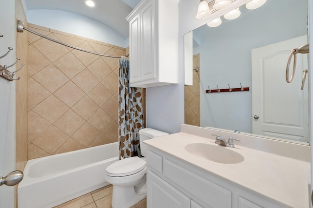 full bathroom featuring vanity, shower / bath combination with curtain, tile patterned floors, and toilet