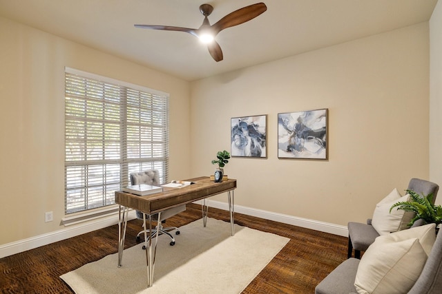 office area with ceiling fan and dark hardwood / wood-style floors