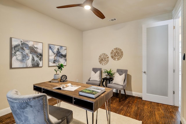 office area with dark wood-type flooring and ceiling fan