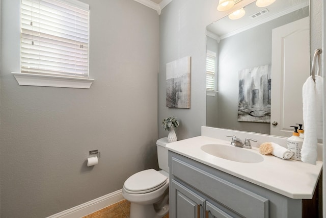 bathroom featuring vanity, tile patterned flooring, crown molding, and toilet