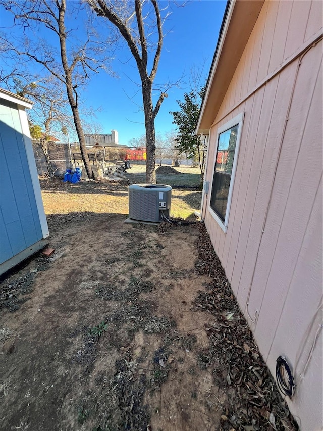 view of yard with central AC unit