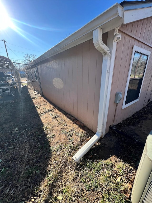 view of home's exterior with cooling unit