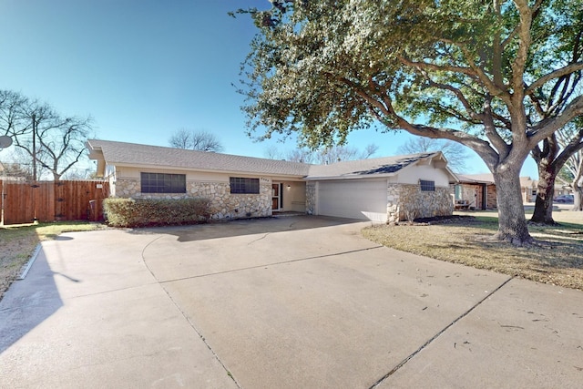 ranch-style home with a garage