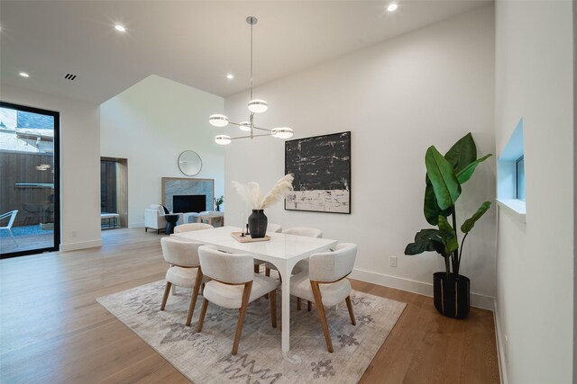 office with built in shelves and light hardwood / wood-style floors