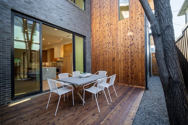 wooden deck with outdoor dining space