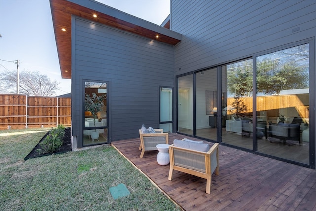 back of house featuring a wooden deck, a yard, and an outdoor living space