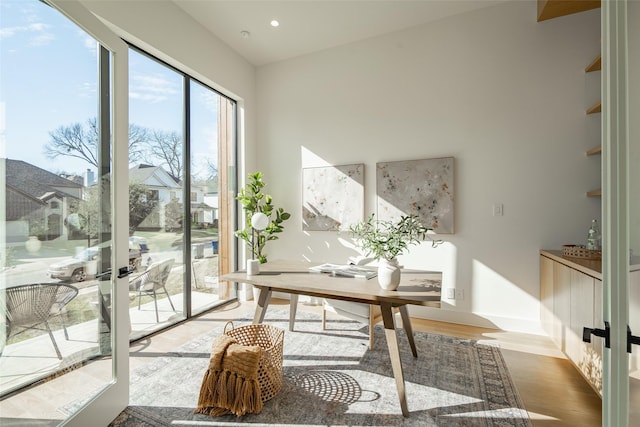 office space with recessed lighting, baseboards, and wood finished floors