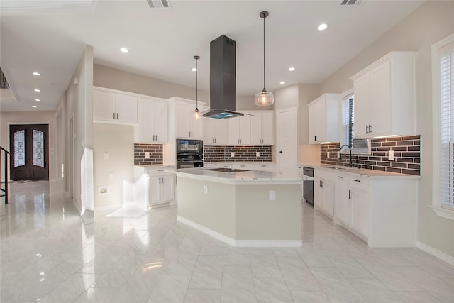 kitchen featuring island exhaust hood, a center island, and white cabinets