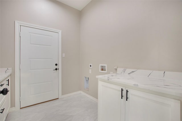 washroom with electric dryer hookup, washer hookup, cabinets, and gas dryer hookup