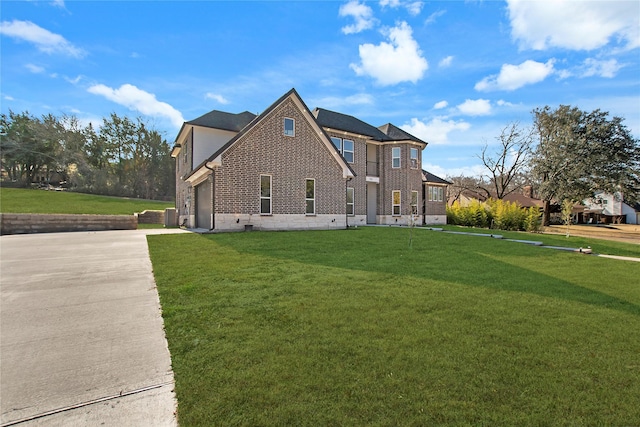 view of side of home with a yard and a garage