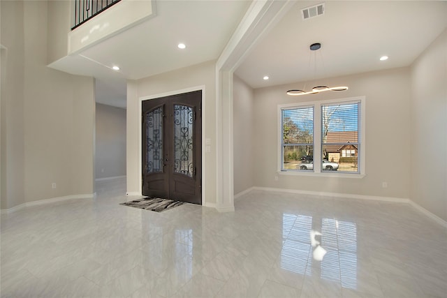 entrance foyer featuring french doors