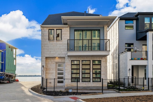 view of front of home with a water view