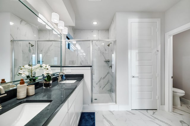 bathroom with walk in shower, vanity, and toilet