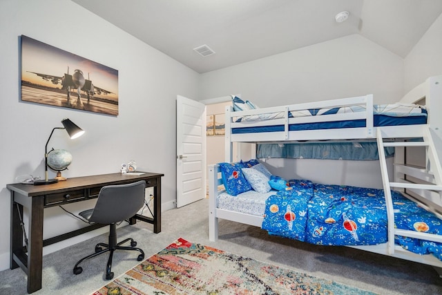 carpeted bedroom with vaulted ceiling