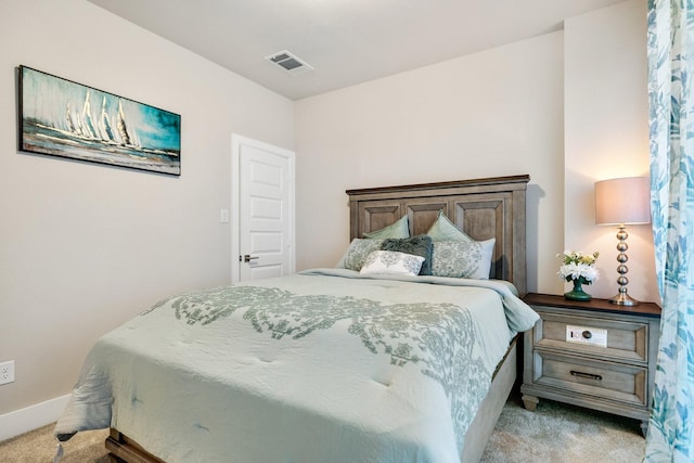 bedroom featuring light colored carpet