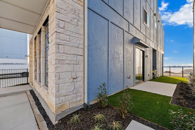 view of side of property with a patio area