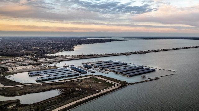 aerial view at dusk with a water view