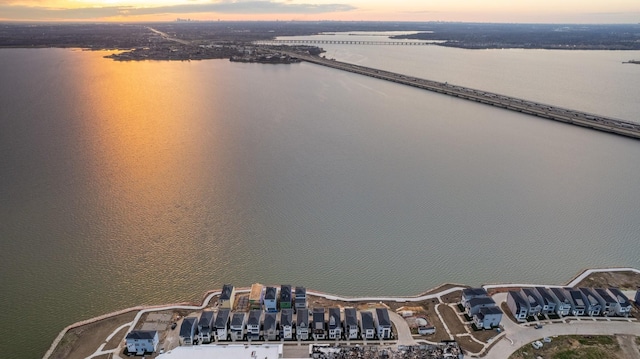 aerial view at dusk with a water view