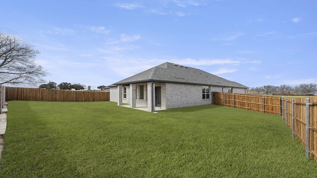 view of yard with a fenced backyard