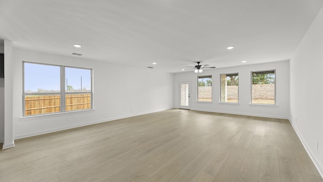 spare room with visible vents, baseboards, a ceiling fan, light wood-type flooring, and recessed lighting