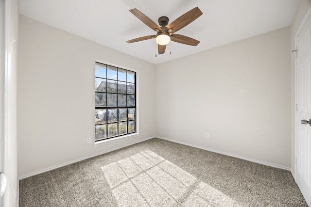 carpeted empty room featuring ceiling fan