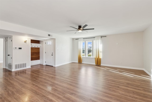 unfurnished room with hardwood / wood-style floors and ceiling fan