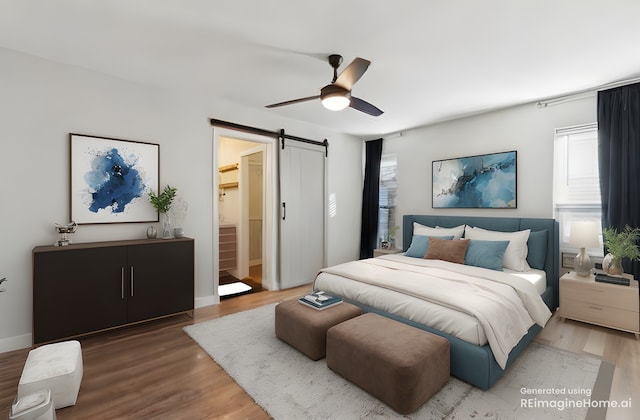 bedroom with hardwood / wood-style flooring, a barn door, and ceiling fan