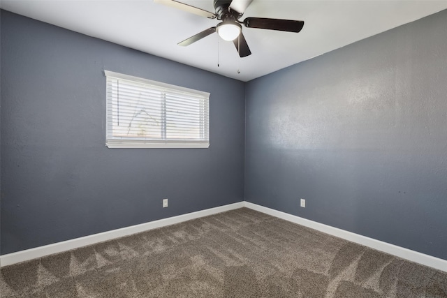 unfurnished room with ceiling fan and carpet floors