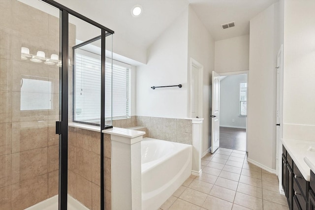 bathroom with vanity, shower with separate bathtub, and tile patterned flooring