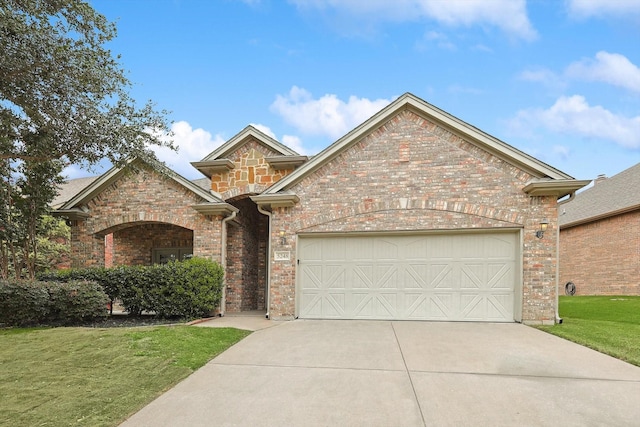 front facade with a garage and a front lawn