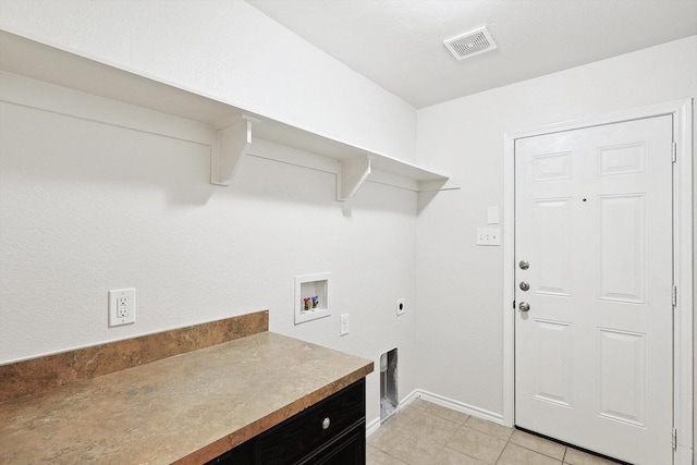 clothes washing area featuring light tile patterned flooring, hookup for an electric dryer, and hookup for a washing machine